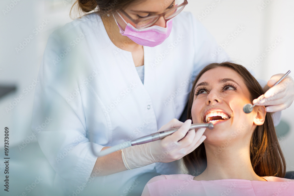 Dentist and patient in dentist office